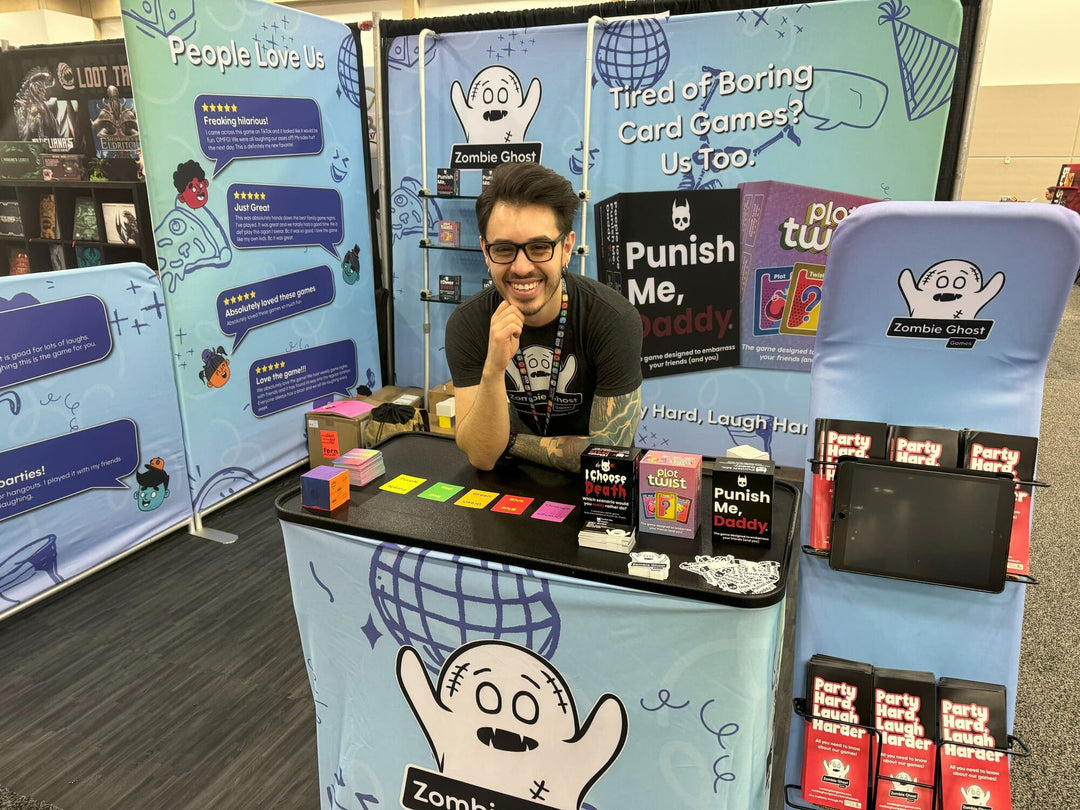 Jake, founder of Zombie Ghost Games, exhibiting at a trade show