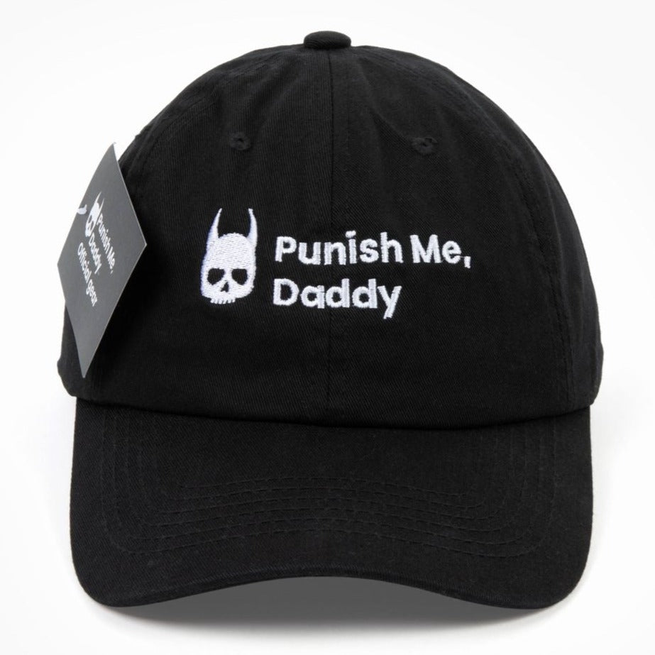 Front photo of black 100% cotton hat with official Punish Me, Daddy trademarked logo in the front